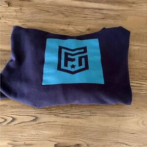 Freedom Industries Navy Blue Hoodie with Teal Logo